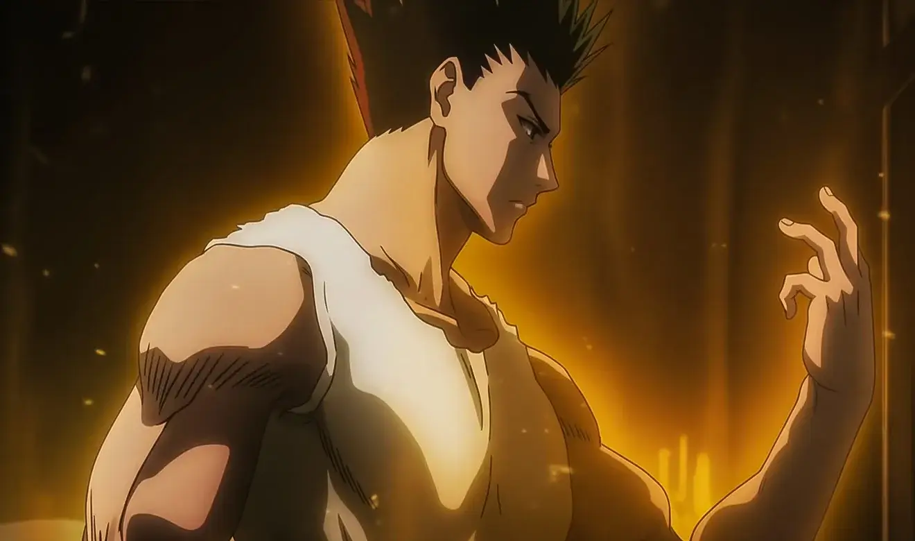 Escena del anime Hunter x Hunter con Gon rodeado de aura dorada mientras utiliza el poder de Nen.