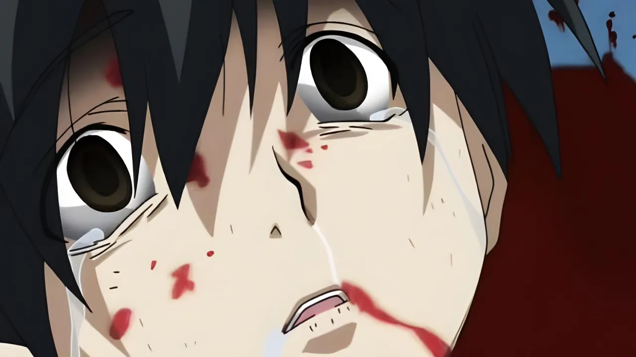 Primer plano de un chico llorando y cubierto de sangre en el impactante anime School Days