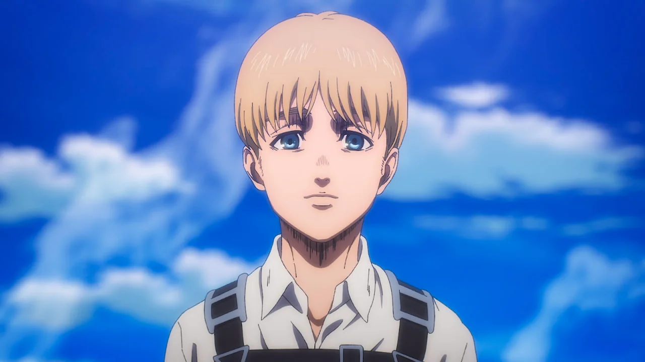 Armin Arlert con expresión seria mirando al horizonte en Attack on Titan