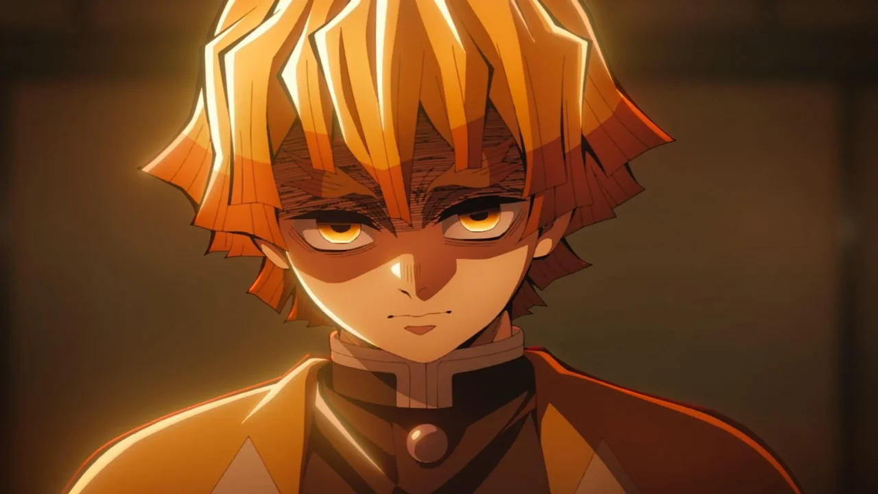 Zenitsu Agatsuma con mirada fija y expresión seria en Demon Slayer, lejos de su imagen de cobarde