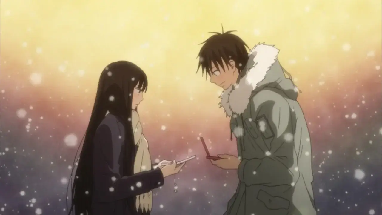 Sawako y Kazehaya intercambiando números de teléfono bajo la nieve en la escena de Navidad de Kimi ni Todoke