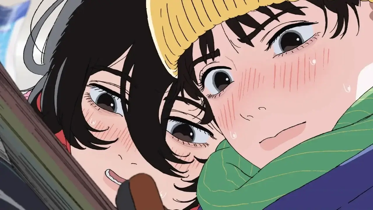ujino y Kyomoto leyendo manga juntas en Look Back, con gorro amarillo y bufanda verde, en una escena de amistad y complicidad